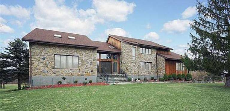This contemporary home offers five bedrooms in a park-like setting This contemporary home offers five bedrooms in a park-like setting