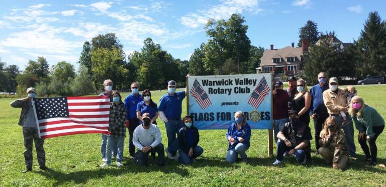 Warwick Valley Rotarians disassembled their “Flags for Heroes” site. Their flags were displayed the past four weeks at the corner of the Chateau Hathorn traffic light. Flags paid tribute to the Rotarians’ and generous community donors’ heroes from all walks of life. Nearly 200 flags saluted heroes of every stripe. In the process, thousands of dollars were raised for the many charities the Warwick Valley Rotary Club supports each year (www.warwickvalleyrotary.org). Photo provided by Chris Olert.