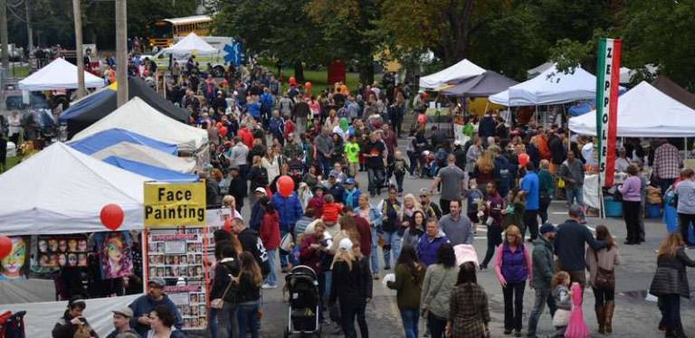 Applefest 2016 draws large crowds despite light rain and cooler weather Photos by Peggy Gavan The crowd on Parkway, where members of the Excelsior Hose Company are selling hot coffee, cider, and donuts, heads towards South Street and then to downtown Warwick.
