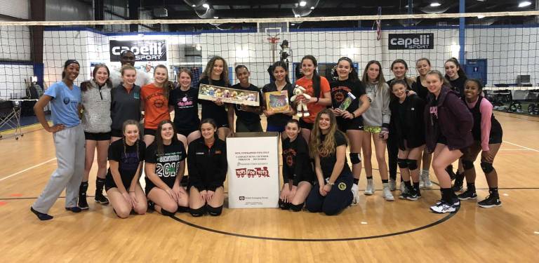 Eclipse Volleyball Club collects for Toys for Tots Eclipse Volleyball Club collects for Toys for Tots