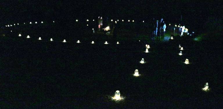 Community connections Before the celebration the Peace Wall had been adorned with luminaries creating a "Circle of Light" to instill a sense of well-being and peace.