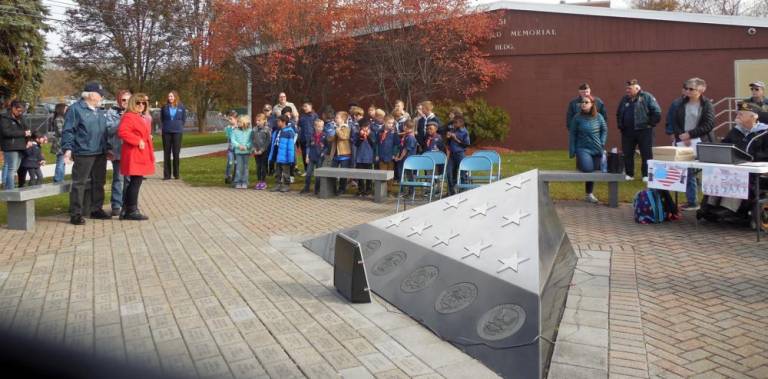 The Pledge of Allegiance during Veterans Day ceremonies in the Village of Florida were led by Cubs Scouts, Boy Scouts and Girl Scouts. Photos presented by Beth Fuller, president of the Ladies Auxiliary of the Florida American Legion Unit 1250.