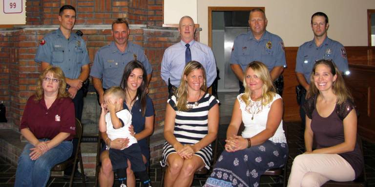 A fourth cup of coffee Photo by Katie Bisaro Gearing up for the upcoming "Coffee with a Cop" event (seated, from left) are: Jennifer Santoro, manager of Dunkin' Donuts in Warwick, the administrators of The Warwick, NY Parents Group - Kristin Meola with her son, Levi, Kerri Fenton Foley, Nicole McCormick and Megan Cardenas; and standing, from left to right from the Warwick Police Department are: Officer Brian Luthin, Lt. John Rader, Chief Thomas McGovern, Lt. Thomas Maslanka and Officer John Harter.