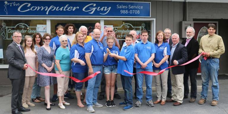 Computer Guy celebrates grand reopening of second store location in Village of Florida Photo by Roger Gavan On Thursday, May 31, Town of Warwick Supervisor Michael Sweeton (far left), Florida Mayor Daniel Harter(far right) and representatives of the Florida and Warwick Valley Chambers of Commerce joined owner Kevin Brand (center), his wife, Roxanne, family and staff, for a ribbon-cutting ceremony to celebrate the store's grand reopening.