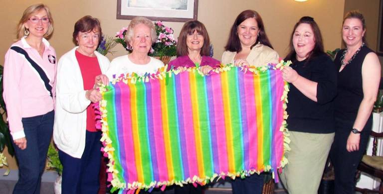 Warwick Ladies Ancient Order of Hibernians donate handmade blankets to Schervier Pavilion residents On Friday, May 4, representatives of the LAOH arrived at Schervier Pavilion with bundles of fleece lap blankets they crafted as a group project. The presentation of the blankets was part of the Bon Secours Warwick Health Foundationís Make This House A Home initiative. From left, Deirdre Hamling, co-chair of Make This House A Home; LAOH members Mary Lahey, President Anita Colman, Miriam Muse, Eileen Higgins, blanket project chair Lynne Koval and Julie Cauda, co-chair of Make This House A Home. Parela Cornine, Helene Earley and volunteer Collette Higgins were not present for the photo.