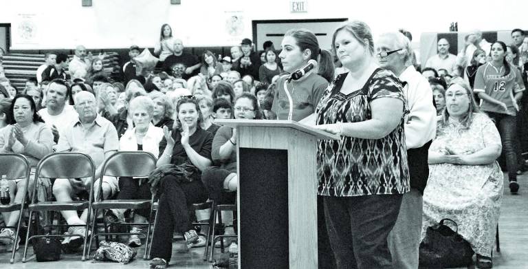The ‘walk for choice’ Photo by Ed Bailey Carolyn McAteer reads the petition at Wednesday's school board meeting, asking the Greenwood Lake Board of Education to reconsider its decision about parental choice and include Tuxedo with Chester and Warwick. On McAteer's left is Lena Buckley.