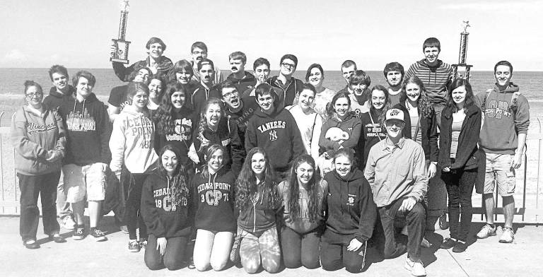 Bravo Members of the Warwick Valley High School Honors Wind Ensemble and Jazz Band celebrate with their first-place trophies from Music in the Parks at Cedar Point, Ohio.