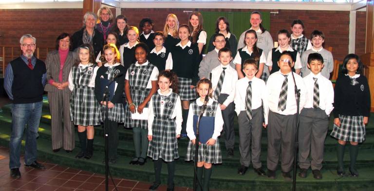 St. Stephen - St. Edward School celebrates Catholic Schools Week Photo by Roger Gavan During the celebration of Catholic Schools Week at St. Stephen - St. Edward Elementary School, student performed in concert. Pictured, beginning at the far left from front to rear: Mayor Michael Newhard, Assemblywoman Annie Rabbitt, Albert Wisner Library Director Rosemary Cooper and Faith Ferguson, president of the St. Stephen - St. Edward Home School Association Executive Board.