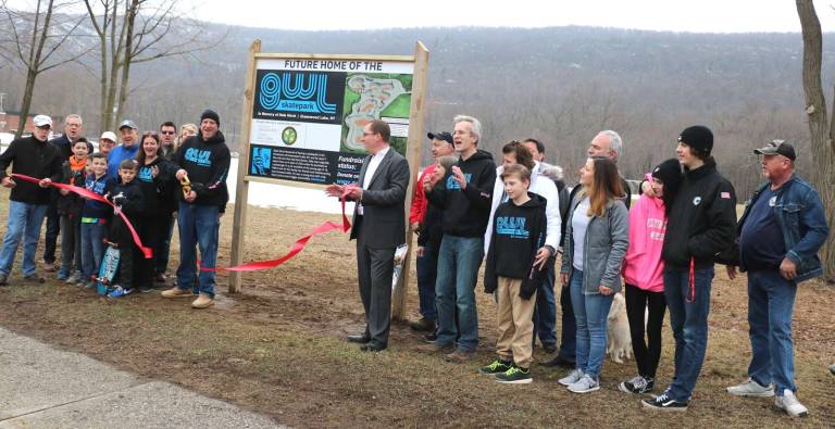Ribbon-cutting held at future site of Greenwood Lake Skatepark Photos by Roger Gavan On Wednesday March 28, at the CVS Field on Windermere Avenue in Greenwood Lake, the GWL Skatepark Corp. officially designated the future site of the “GWL Skatepark - In Memory of Dale Hirrel” with a ribbon-cutting by Kurk Koziel, vice president of the GWL Skatepark Corp.