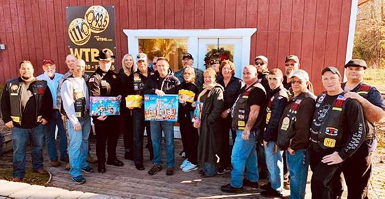 WTBQ launches third annual Toys for Military Tots drive Provided photoFront from left: Larry Neumann of Vet2Vet, MSgt. Sara Pasterollo of Stewart Air Force Base, Captain Paul Arteta of the Orange County Sheriff's Office, Kelly Williamson of the 105th Airlift Wing at Stewart, Bob Caridi, president of the Nam Knights, Orange County Executive Steve Neuhaus, Pete and Laura Rollins, representatives of the Disabled American Veterans. Rear from left: Dan Burger, commander of Warwick VFW Post 4662, Taylor Sterling, WTBQ station manager, Station Owner Frank Truatt, Pat Rooney and other members of the Nam Knights.