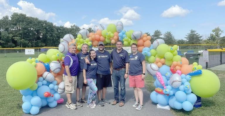 State Sen. Mike Martucci (second from right) poses with Beautiful People Board members and volunteers. Photo by Jane Kunzweiler.