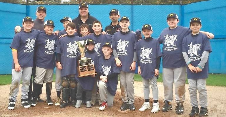 The 2019 Warwick Black 2019 District 19 Harvest Cup Champions with manager Dr. Dominick Berlingieri (center rear) and Assistant Coaches Tom Roome and Danish Yazdani.