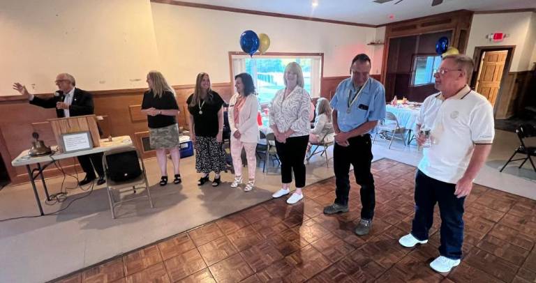 Rotary District Governor Larry Palant, left, installs new officers of the Warwick Valley Rotary Club. Shown, left to right, are Palant, Laura Barca, president; Laurene Iammatteo, vice president; Tina Buck, treasurer and vice president of the Warwick Valley Rotary Foundation; Layna Skok, recording secretary; John McGloin, president of the club foundation; and Neil Sinclair, Rotary Club president-elect. Not pictured is Patti Lurye Dempster, corresponding secretary.