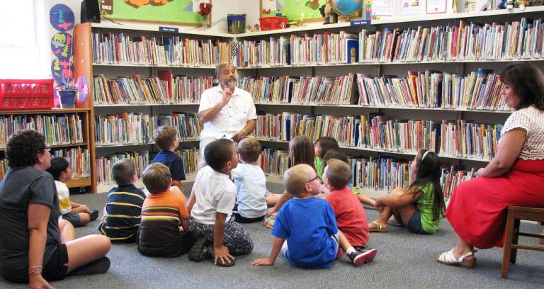 Florida Public Library hosts Get Ready for Kindergarten program on Aug. 16 Get Ready for Kindergarten 2011: Golden Hill Library Teacher Marlayne Sick and Florida Public Libraryís Maria Martinez listen to Golden Hill Principal Ron DePace telling the soon-to-be Kindergarten students a story about the first day of school.