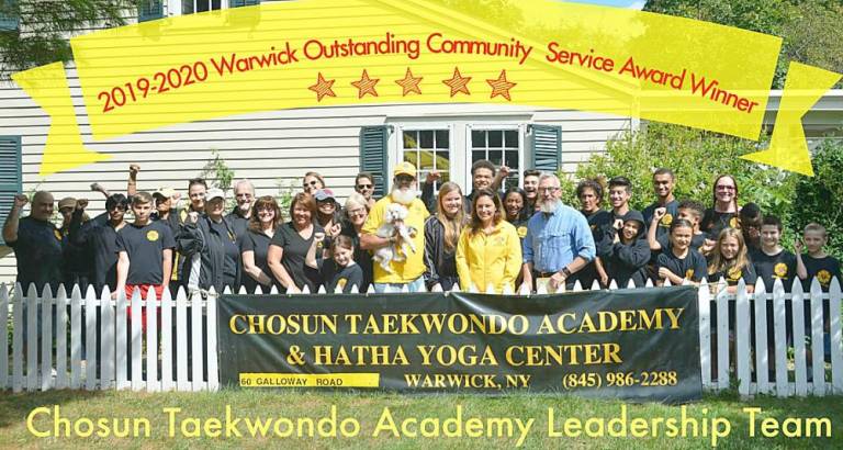 The Chosun Taekwondo Academy Leadership Team with Warwick Mayor Michael Newhard and members of the Warwick Lions Club and Warwick Valley Rotary Club during a previous book sale. Provided photo.