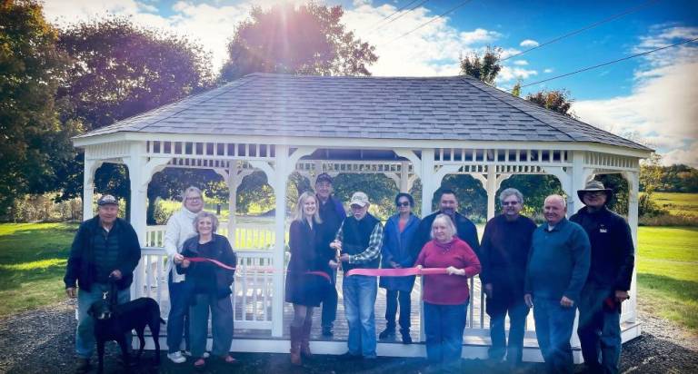 At the ribbon cutting, left to right: