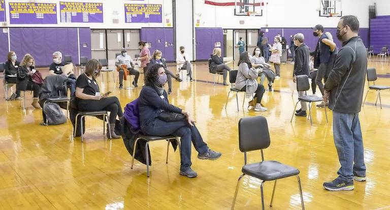 The Warwick Valley Central School District took a major step toward getting more students back to full in-person learning by hosting a pop-up COVID-19 vaccination clinic for employees on Sunday, Feb. 28. In partnership with Sun River Health, 300 District employees received their first dose of the Moderna vaccine at Warwick Valley High School. School Superintendent Dr. David Leach talks to employees after their received the vaccinations in the high school gymnasium. Photos by Tom Bushey.