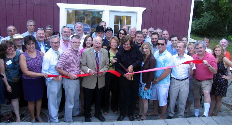 File photo by Roger Gavan Front from left holding the ribbon, Mayor Michael Newhard, Town of Warwick Supervisor Michael Sweeton, former New York State Senator William Larkin, WTBQ station manager Taylor Sterling and owner Frank Truatt.