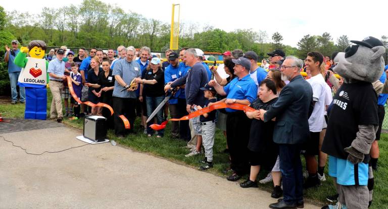 The Daniel Fratto Field for Beautiful People baseball program opens Photos by Roger Gavan During the ceremony Town of Warwick Supervisor Michael Sweeton (left) and Mayor Michael Newhard (right) held the ribbons, provided by the Orange County and Warwick Valley Chambers of Commerce, which were cut by members of the Beautiful People Board of Directors (center).