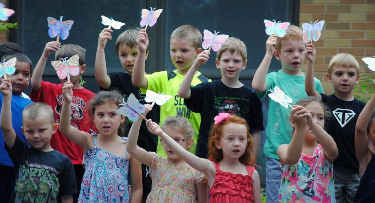 Sanfordville Elementary has a new butterfly garden Photos by Maureen Westphal Sanfordville kindergarten students sing a butterfly song.
