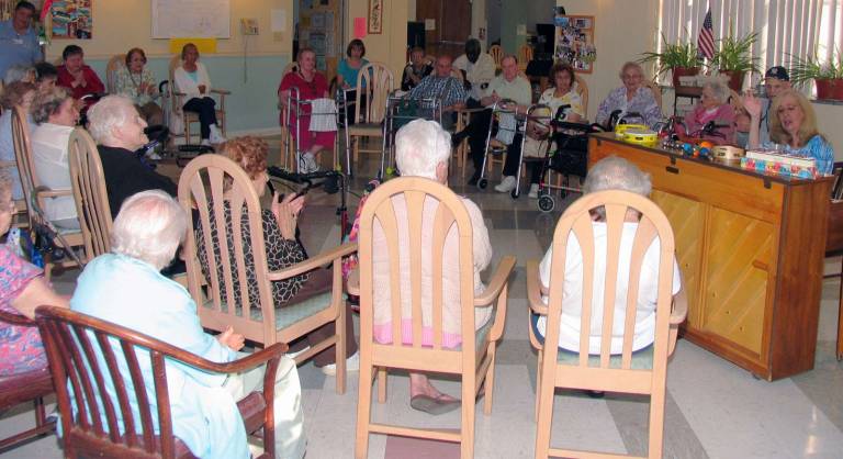 Each Wednesday Mount Alverno Center residents have an opportunity to enjoy an evening of singing, laughing and playing instruments with Music Therapist Melinda Burgard
