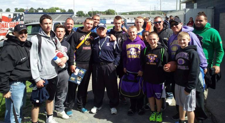 Warwick QB’s attend football camp Photo provided by Warwick Valley Athletic Department Ten Warwick quarterbacks from Grades 5 through 11 attended the Curry Quarterback Camp in Berwick, Pa. Pictured from left to right are: Bill Garcia, Brendan Bauer, Dylan Hayes, Greg Sirico, Brad Garcia, John Garcia, Coach George Curry, Rocco Garcia, Andrew LeDuc, Gene Decker, Gregory Sirico, Matt Hanson, Paul LeDuc, John Garcia Sr., Joey Fotino and Justin Depierro. Not pictured: Christopher Beattie.