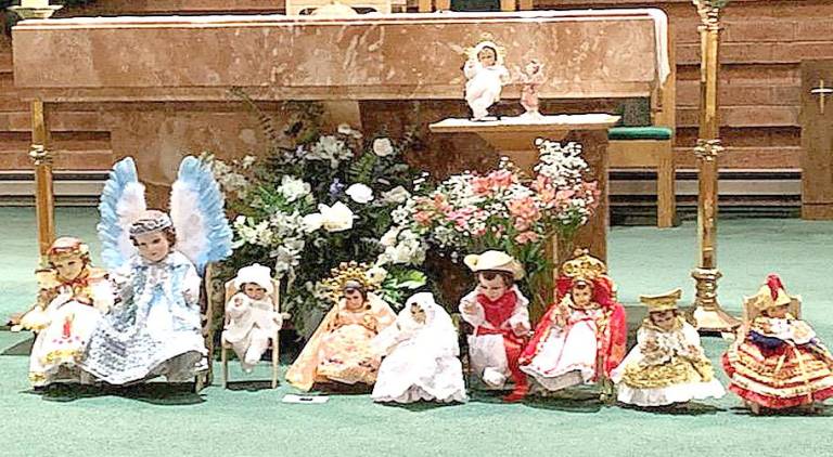 All the Nino Dios (images of the Christ child in the form of a doll) were placed by the altar.