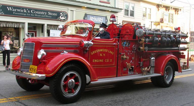 Warwick welcomes firefighters from near and far Parade watchers enjoyed seeing vintage fire apparatus.