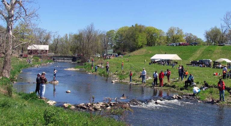 'Take a Kid Fishing Day scheduled Saturday, May 3 Last year the weather could not have been better for catching fish as about 200 people, youngsters along with their parents or grandparents, enjoyed comfortable temperatures, clear blue skies and a creek well stocked with trout.