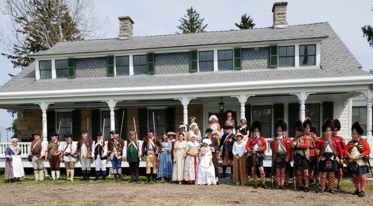 Provided photo Reenactors on the porch of the Gen. John Hathorn House in Warwick during Founders&#x2019; Day.