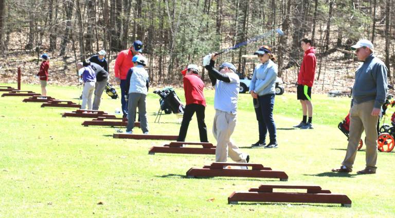 Hickory Hill Golf Course hosts US Kids Golf Tour Junior golfers practice at the driving range.