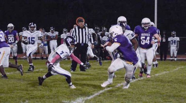Warwick football defeats Middletown Warwick running back Harrison Parrelli (#5) powers for a big run versus Middletown as tTthe Division Champion Wildcats advanced in the AA Football Tournament.