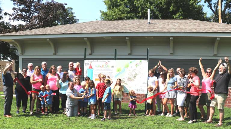 Warwick Playground Dreams seeks sponsors for recreational equipment On Wednesday, August 15, Mayor Michael Newhard (far left), Village Trustees and members of the Warwick Valley Chamber of Commerce joined Hannelore Chambers (center), president of Warwick Playground Dreams, its members and a group of children to celebrate the new phase of fundraising with a ribbon cutting ceremony.