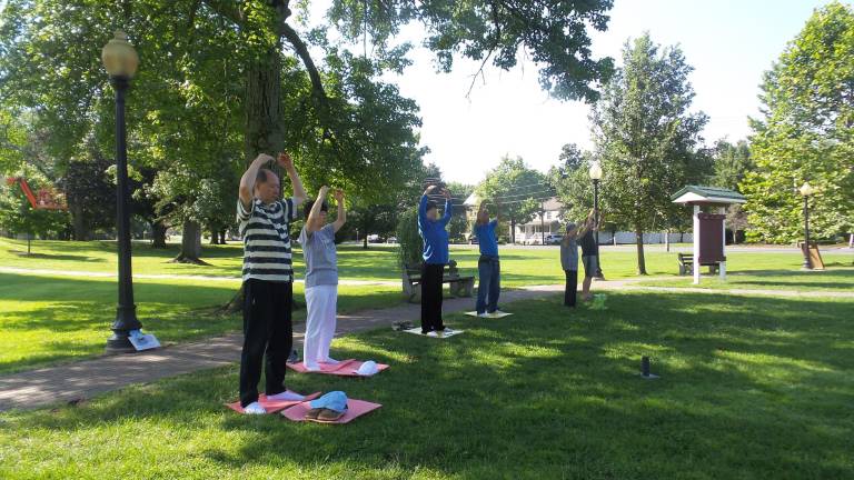 Falun Dafa practitioners in Goshen perform specific exercises as a means to achieving spiritual perfection.