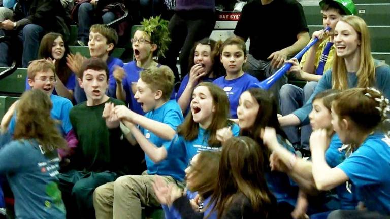 Odyssey of the money This image is a video grab by videographer Paul Romano This photo of the team was taken the very moment the members of the Warwick Valley Community Center Odyssey of the Mind team learned of they were going to the World Finals next month at Michigan State University. Pictured, from left to right, are: Patrick Sliter, James Byrne, Jacob Gaydos, Claire Neary, Madeleine Wadeson Julia Beggel and Josie Romano; pictured to the right and just behind the team is volunteer assistant coach Julia Heeren. Not pictured are volunteer coaches Donna Denny and Polly VanderKruik.