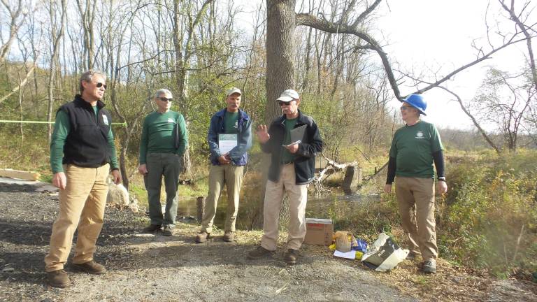Rotten, broken, dangerous Goosepond bridge is repaired The Long Distance Trails Crew: Erik Garnjost, crew leader; Marty Costello, crew leader; Chris Reyling, crew chief; David Booth, crew member (VIP leader); Bob Fuller, crew leader (Photo by Frances Ruth Harris)