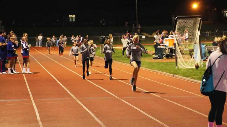 Go Mileage Club: Friday Night Lights Half Mile Run Sixth grader Caitlin Larney crossed the finish line in first place with a time of three minutes and ten seconds. Twin sisters Janiya Chatman and Amiya Chatman followed in second and third places.