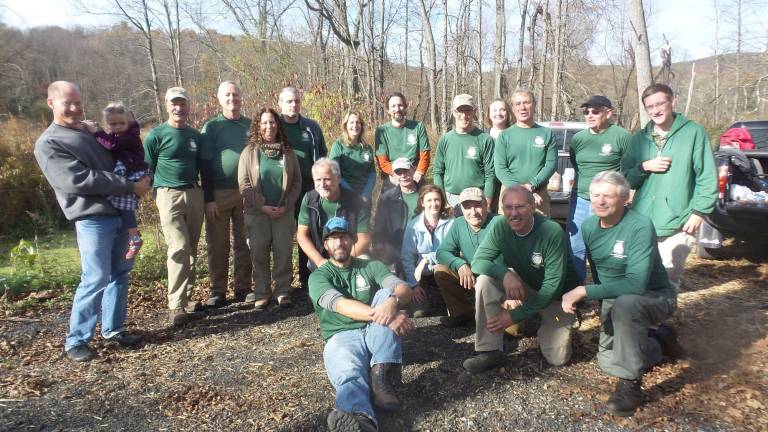 Rotten, broken, dangerous Goosepond bridge is repaired The volunteers stop for a group shot (Photo by Frances Ruth Harris)