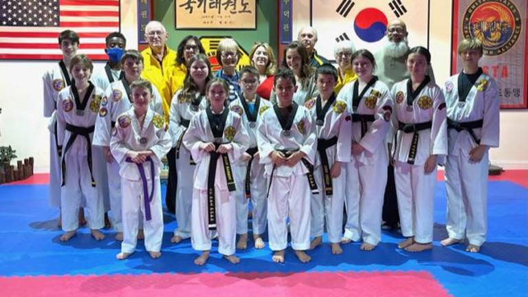 Chosun Leadership Team members and directors and officers of the Warwick Lions Club. The group reently donated $950 to the Warwick Lions Club. Photo courtesy of Chosun Taekwondo.