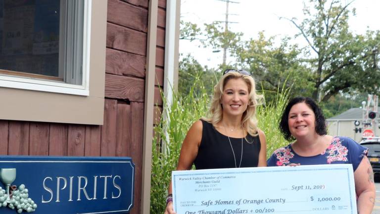 Merchant Guild presents check to Safe Homes of Orange County Merchant Guild presents check to Safe Homes of Orange County