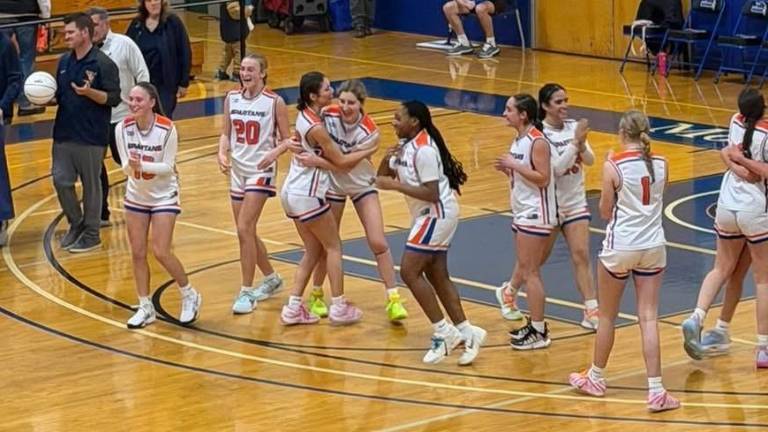Spartan Girls Varsity Basketball team celebrates their clinching of the Section 9 Class C championship.
