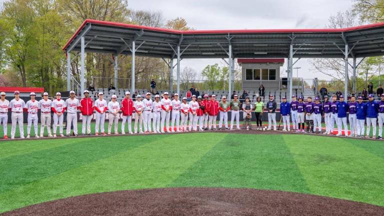 Warwick and North Rockland baseball teams surround Wounded Warrior Tonya Oxendine prior to first pitch on Saturday April 25.