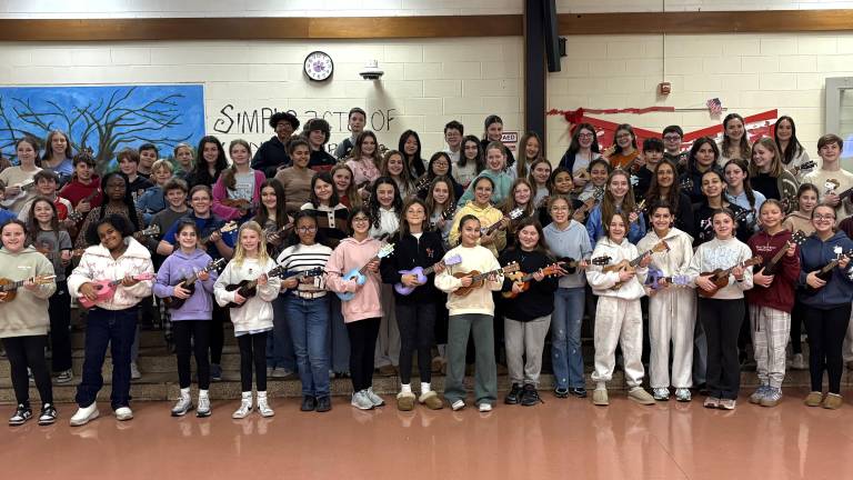 WVMS Ukulele Club students pose with their instruments.