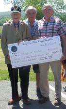 Senator Bill Larkin (left) presents a $150,000 check to Village of Chester Mayor Tom Bell (right)