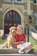 Mount Saint Mary College’s Nancy Gartin-Checchi with her golden retriever Mac. Photo by Lee Ferris
