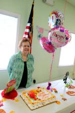 Louise Daubert is about to cut the cake for her 90th birthday celebration at The Warwick Valley Seniors Club.