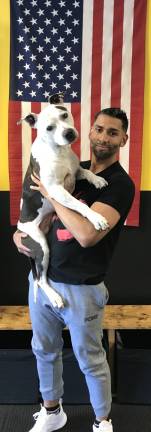Provided photo Bryan Caballero, co-owner of CKO Kickboxing in Warwick, with Jay Jay, pit bull ambassador and gym mascot.
