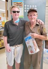 Business owner Craig Wadeson poses with now retired UPS driver Tom Dempsey. Provided photo.