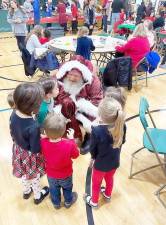 More than 170 children, along with their families, attended the eight annual Breakfast with Santa at St. Stephen-St. Edward School Gym in Warwick sponsored by the Warwick Valley Knights of Columbus. The breakfast was good, but Santa was the star.