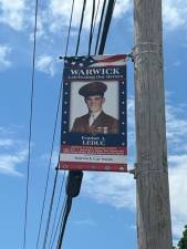 A tribute banner honoring Evariste A. Leduc, a U.S. Marine who served in World War II, Korea and Vietnam.